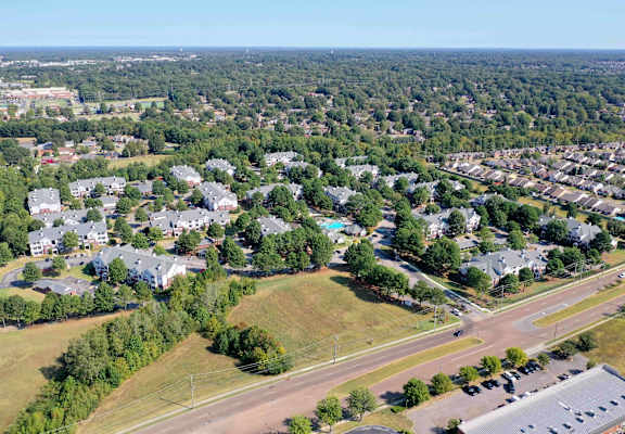 an aerial view of a neighborhood with houses and trees