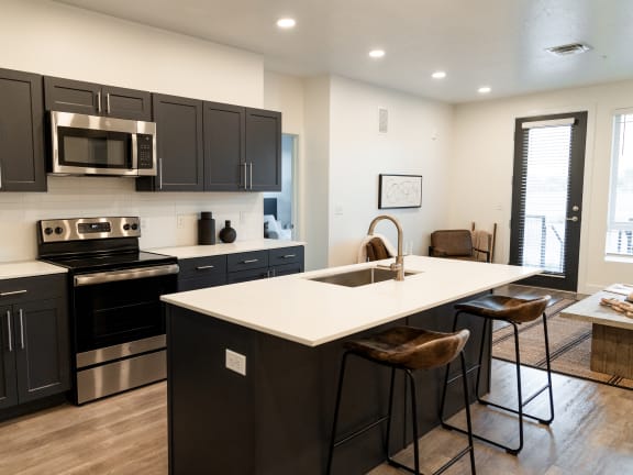 Kitchen with Island at The Arza Apartments in American Fork, UT