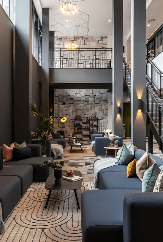 a living room with couches and a fireplace