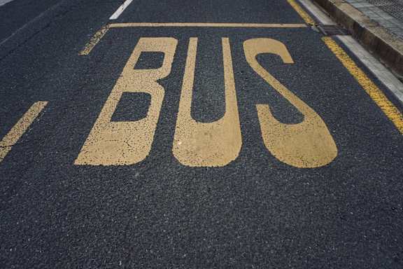 A road with the word BUS painted on it.