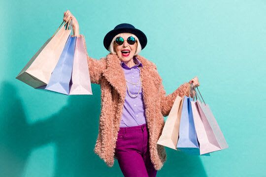 a woman in a fur coat holding shopping bags  at Loma Linda Springs, Loma Linda, CA, 92354