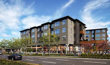 a rendering of an apartment building on a city street