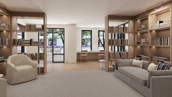 a living room with a couch and bookshelves