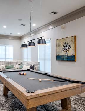 Billiards Table In Clubhouse with wide windows at Silverado, Frisco, TX
