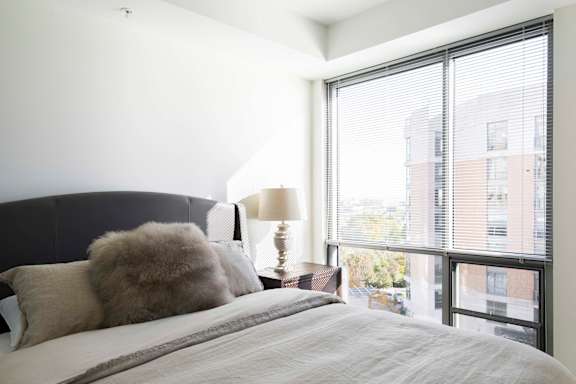 Floor to ceiling windows in the bedrooms of Midtown Crossing apartments provide plenty of natural light in the rooms