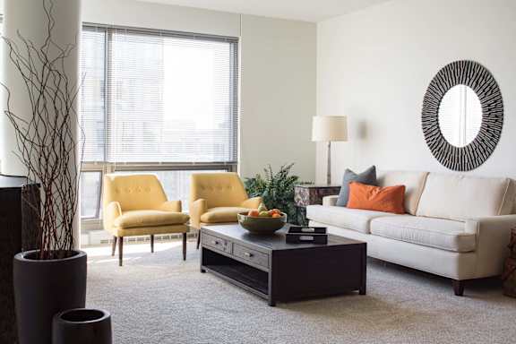 Furnished living room with huge floor to ceiling windows