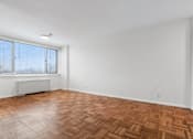 Thumbnail 48 of 59 - A room with a wooden floor and a window with blinds.