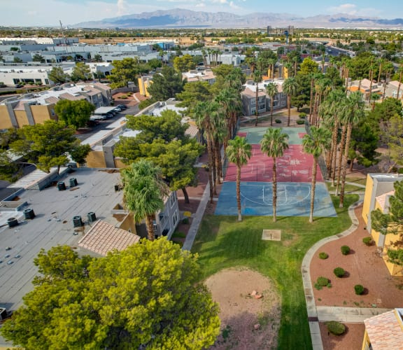 an aerial view of a city with a pool and palm trees at Citrus Apartments, Las Vegas