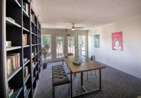 table and chairs and a bookshelf at Woodland Crossing , Woodland, CA 95695