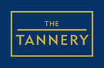 the logo of the wrangler company is shown in a circle at The Tannery, Glastonbury