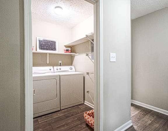 a small laundry room with a washer and dryer
