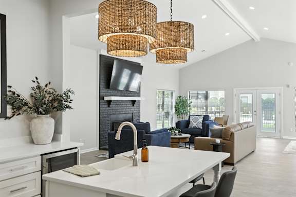 A modern kitchen with a white countertop and a large island.