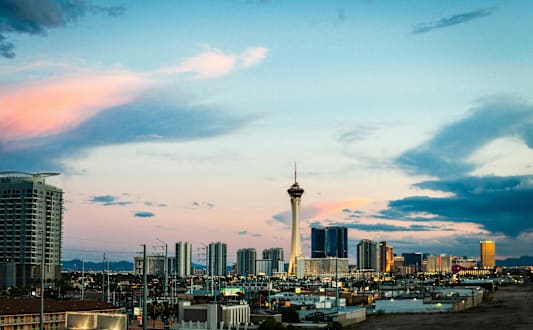 A city skyline with a tall tower in the center.