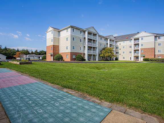 a running track in front of an apartment building