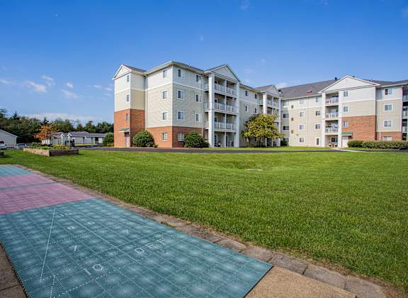 a running track in front of an apartment building