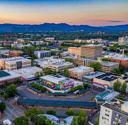 an aerial view of the city at sunset