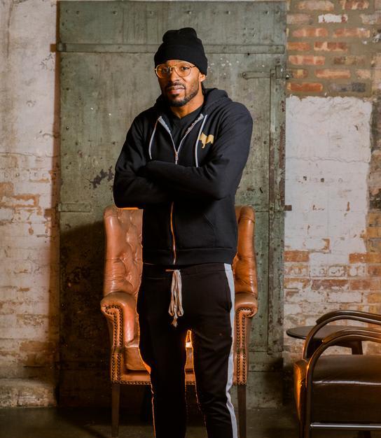 a man standing in front of a chair