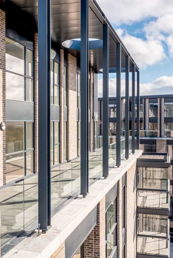 A modern building with glass and brick exterior.