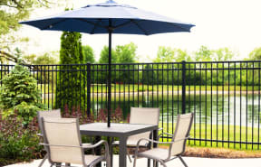 Outdoor Table near Community Lake at Foxboro Apartments, Wheeling, Illinois