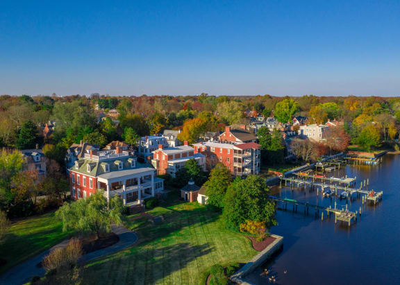 an aerial view of houses on the water at a marina