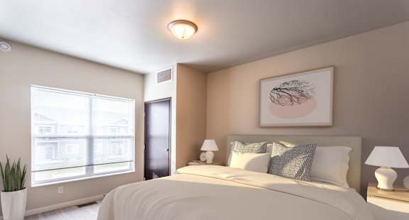a bedroom with a large bed and a window