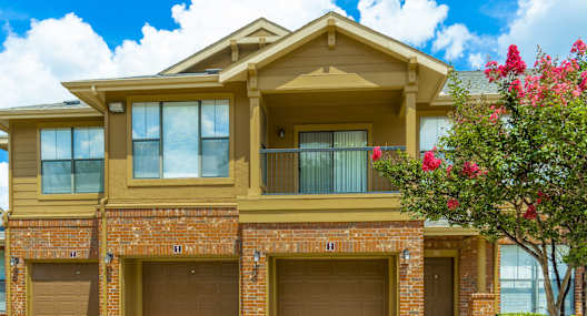 a large house with two garage doors