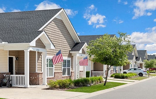 a row of houses flags on the front at River Oaks, Little River