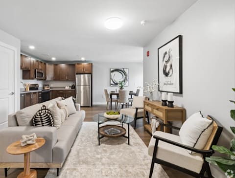 A modern kitchen with wooden cabinets and stainless steel appliances.