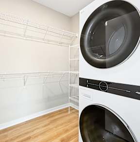 A laundry room with a washer and dryer at Siena Crossing Apartments, Ankeny, IA, 50223