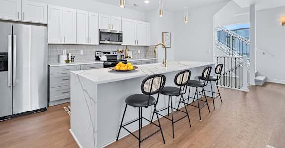 Kitchen with white cabinets at The Flats at West Glen Apartments, West Des Moines, 50266