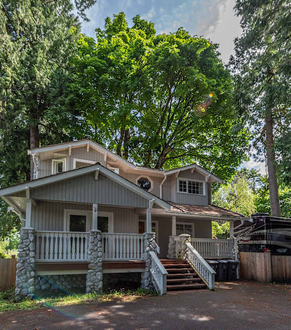a house with a front porch and steps leading up to it