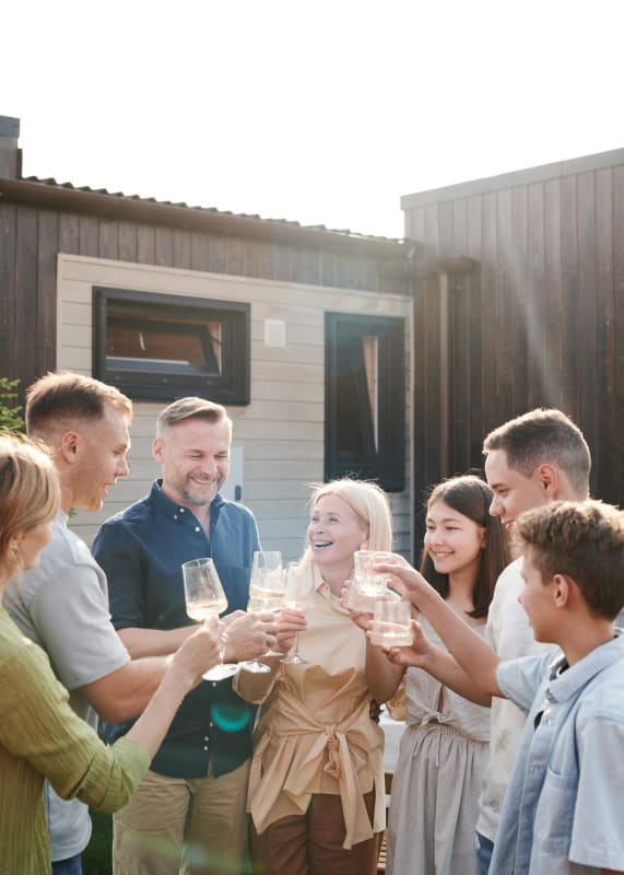 a group of people celebrating with wine glasses at Balfour 296 in Lilburn, GA 30047