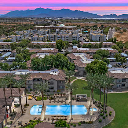 A residential area with houses and a swimming pool.