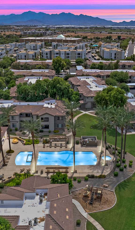 A residential area with houses and a swimming pool.