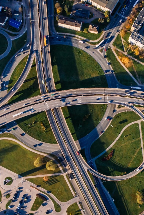 an aerial view of highways and intersections at night