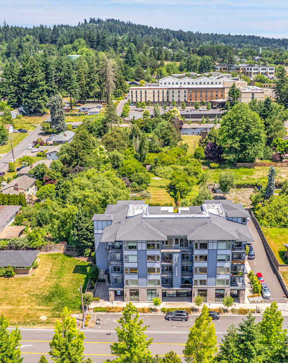 An aerial view of a town with a large building in the center.