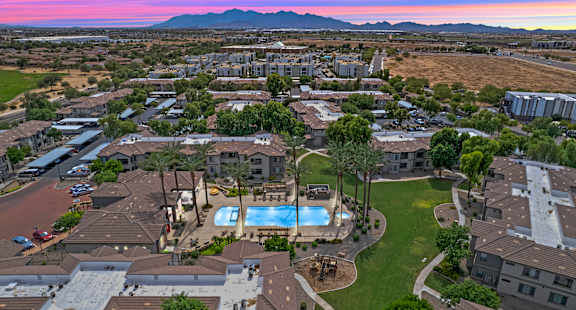 A residential area with houses and a swimming pool.