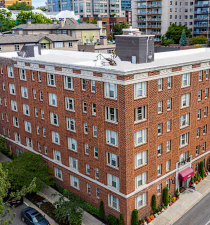 a view from above of a brick building with a white roof at Stockbridge Apartment Homes, Seattle, 98101