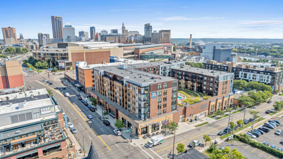 an aerial view of a city with buildings and a city skyline