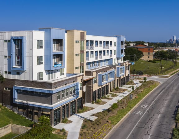 an aerial view of an apartment building on a city street