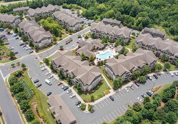 bird's eye view residential area with houses and cars.