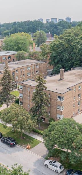 a view from the top of a building of a large brick building with a long chimney
