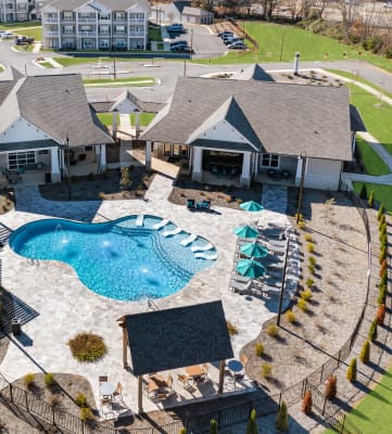 Aerial view of the swimming pool, sundeck, and resident clubhouse at The Alexandria