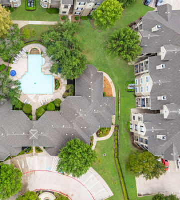 a birdseye view of a backyard with a swimming pool