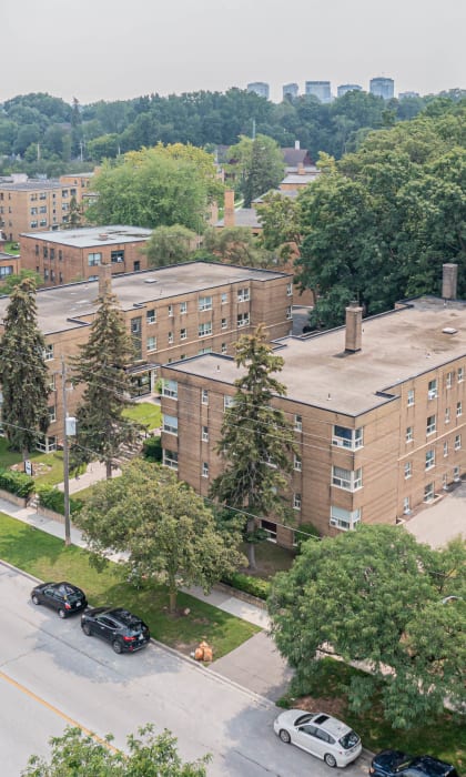 a view from the top of a building of a large brick building with a long chimney