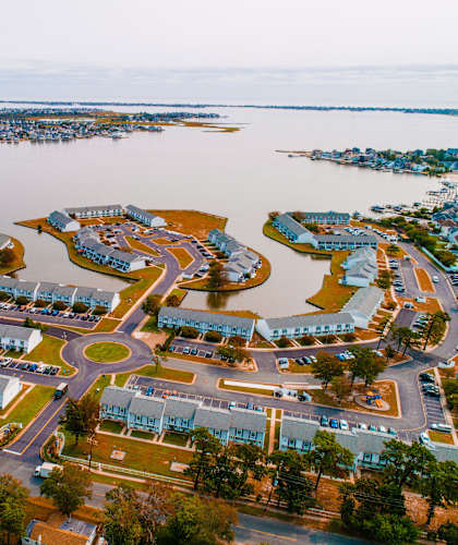 an aerial view of a city with a body of water