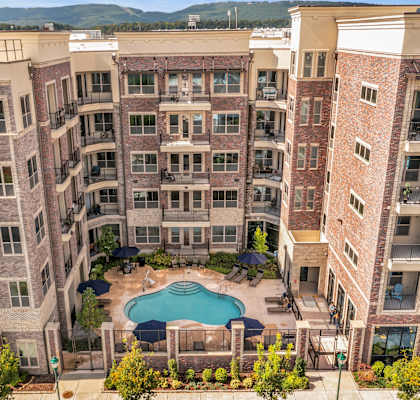 an aerial view of a large apartment building with a swimming pool at 17 Broad, Chattanooga, TN