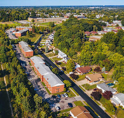 an aerial view of a neighborhood with houses and trees