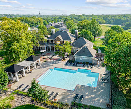 A large house with a pool in the backyard.