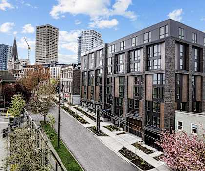 the exterior of a building with a city in the background